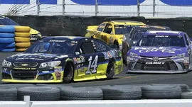 Tony Stewart, left, leads Denny Hamlin through Turn 11 during the NASCAR Sprint Cup Series auto race Sunday, June 26, 2016, in Sonoma