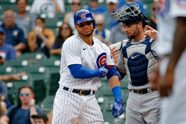 Willson Contreras and William Contreras exchange lineup cards