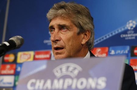 Manchester City coach Pellegrini speaks during a news conference on the eve of their Champions League Group D soccer match against Borussia Moenchengladbach in Moenchengladbach