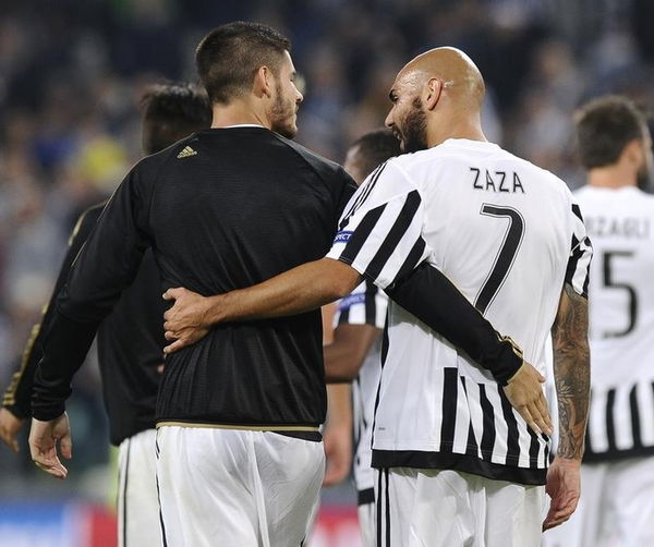 Juventus Zaza leaves the pitch with his team mate Morata at the end of the match against Sevilla&#8217;s during their Champions League group D soccer match at Juventus stadium in Turin