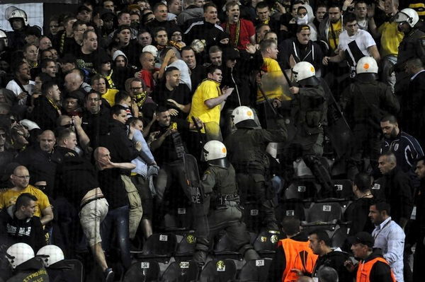 Greek riot police push back Borussia Dortmund&#8217;s supporters during their Europa League group C soccer match against PAOK Salonika at the Toumba stadium in the northern city of Thessaloniki