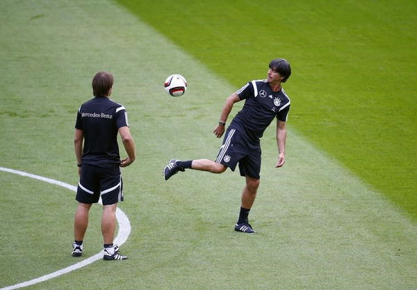 Assistant coach Thomas Schneider looks at Joachim Loew, coach of the German national soccer team during a training session of the German squad in Frankfurt