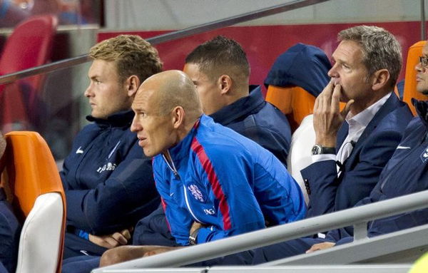 Arjen Robben of the Netherlands watches the match from the substitutes&#8217; bench after he suffered an injury during their Euro 2016 qualifying soccer match against Iceland in Amsterdam