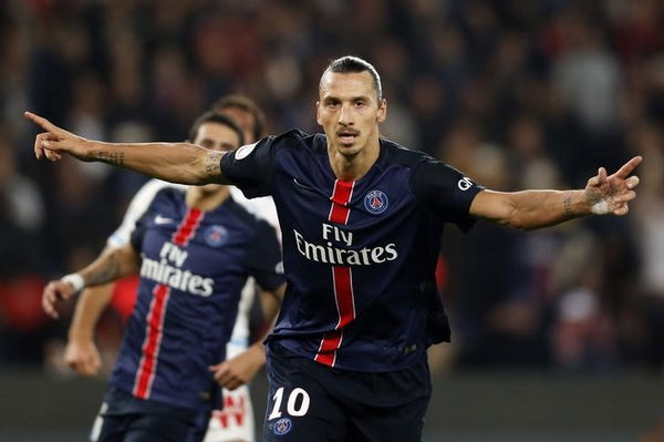 Paris St Germain&#8217;s Ibrahimovic reacts after scoring against Olympique Marseille during his French Ligue 1 soccer match at the Parc des Princes stadium in Paris