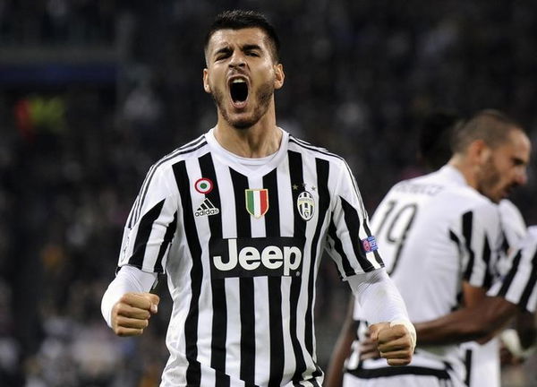 Juventus Morata celebrates after scoring against Sevilla&#8217;s during their Champions League group D soccer match at Juventus stadium in Turin