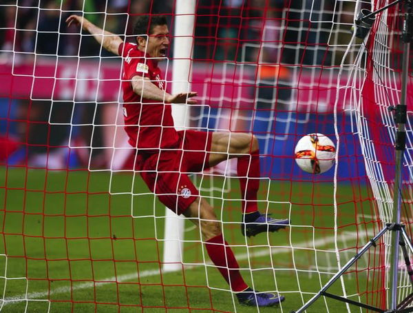 Bayern Munich&#8217;s Lewandowski scores a goal against Borussia Dortmund&#8217;s Buerki during their German first division Bundesliga soccer match in Munich