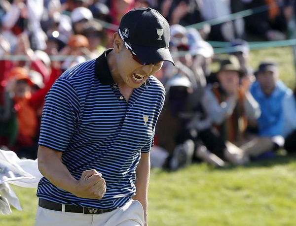 Bae of South Korea reacts after sinking putt to defeat U.S&#8217;s Fowler and Walker on 18th hole during four ball matches of 2015 Presidents Cup golf tournament at the Jack Nicklaus Golf Club in Incheon