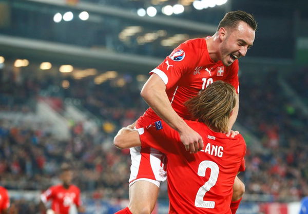 Switzerland&#8217;s Lang celebrates his goal with team mate Drmic during their soccer match against San Marino&#8217;s in St. Gallen