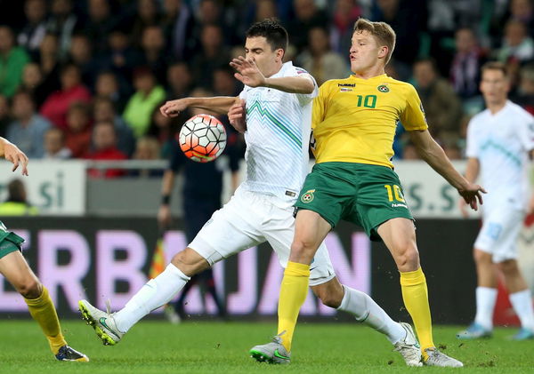 Slovenia&#8217;s Ilic fights for the ball with Lithuania&#8217;s Slivka during their Euro 2016 qualifying soccer match in Petrol arena in Ljubljana