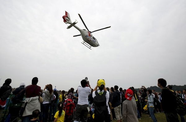 A medical helicopter carries Angelis in Motegi