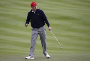 U.S. team member Spieth reacts after sinking his putt on the ninth hole during their four ball matches of the 2015 Presidents Cup golf tournament at the Jack Nicklaus Golf Club in Incheon