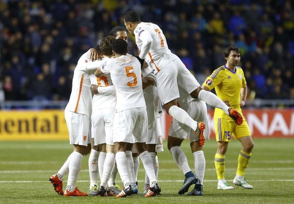 Players of Netherlands celebrate goal scored by Wijnaldum during their Euro 2016 group A qualifying soccer match against Kazakhstan at Astana Arena stadium in Astana