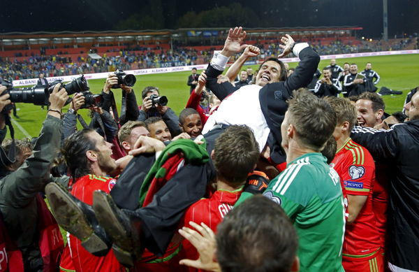 Wales coach Chris Coleman celebrates with players after their Euro 2016 qualifying soccer match against Bosnia in Zenica