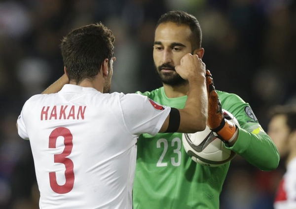 Turkey&#8217;s Calhanoglu and Babacan celebrate defeating Czech Republic in Euro 2016 qualification soccer match in Prague