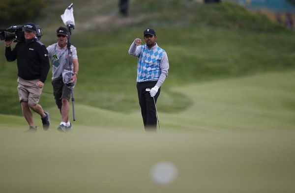 International team member Anirban Lahiri of India gestures after hitting a shot on the fifteenth green during the four ball matches of the 2015 Presidents Cup golf tournament in Incheon