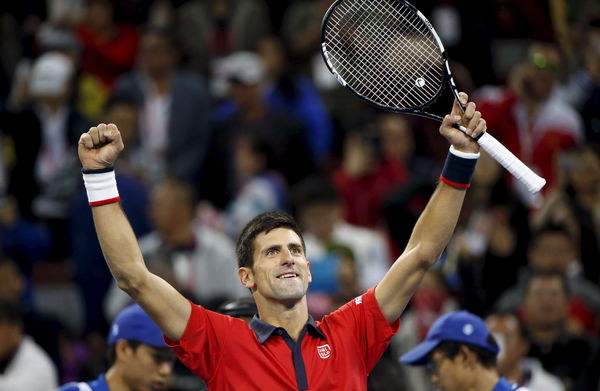 Djokovic celebrates after winning the men&#8217;s singles final match against Nadal at the China Open Tennis Tournament in Beijing
