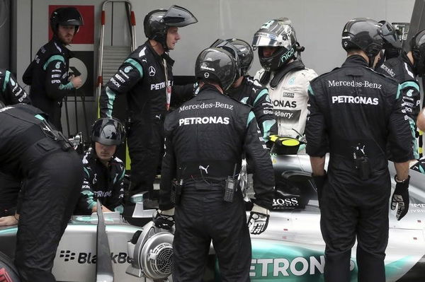 Mercedes Formula One driver Rosberg of Germany stands in pit lane after he had a problem with his car during the Russian F1 Grand Prix in Sochi