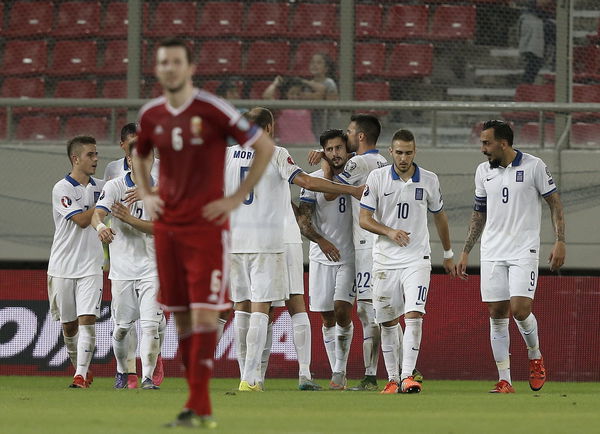 Greece&#8217;s Kone is hugged by his teammates after his goal during their Euro 2016 group F qualifying soccer match against Hungary at the Karaiskakis stadium in Piraeus