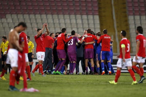 Croatia&#8217;s players and team officials celebrate qualifying for the Euro 2016 finals after defeating Malta 1-0 during their Euro 2016 Group H qualification soccer match at the National Stadium in Ta&#8217; Qali, outside Valletta