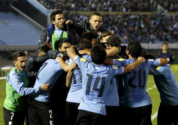 Uruguay&#8217;s players celebrate after scoring a goal against Colombia during their 2018 World Cup qualifying soccer match at the Centenario stadium in Montevideo