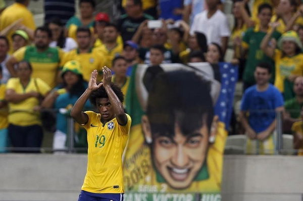 Willian of Brazil celebrates after winning their 2018 World Cup qualifying soccer match against Venezuela in Fortaleza, Brazil