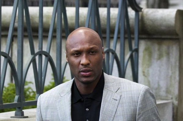 Basketball player Lamar Odom departs the New York state Supreme Court after a child custody hearing with his ex-girlfriend, Liza Morales, in Manhattan