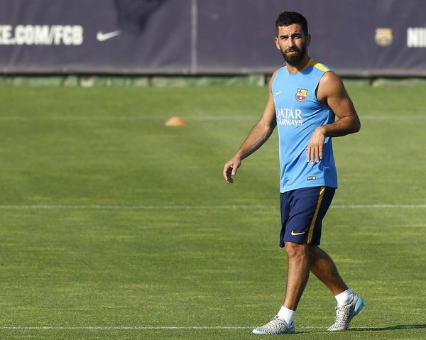 Barcelona&#8217;s soccer player Turan looks to his team mates during a training session at Joan Gamper training field in Sant Joan Despi, near Barcelona