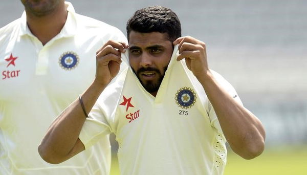 India&#8217;s Jadeja pulls up his shirt collar as he walks across the field during a training session before Thursday&#8217;s second cricket test match against England at Lord&#8217;s cricket ground in London