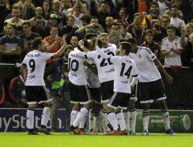 Valencia&#8217;s players celebrate after they scored a goal against Gent during their Champions league Group H soccer match at the Mestalla stadium in Valencia