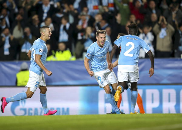 Malmo&#8217;s Markus Rosenberg celebrates with his teammates after scoring the opening goal during their Champions League Group A soccer match against Shakhtar Donetsk in Malmo, Sweden