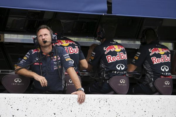 Red Bull Formula One Team Principal Christian Horner looks up at the sky during the qualifying session for the Japanese F1 Grand Prix