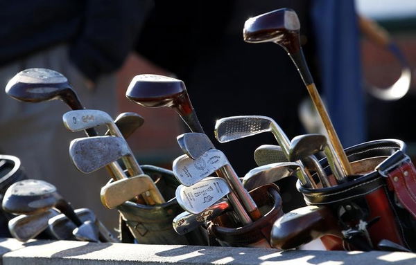 Sets of hickory golf clubs sit outside clubhouse during World Hickory Open Golf Championship at Monifeith Links golf course in Monifeith