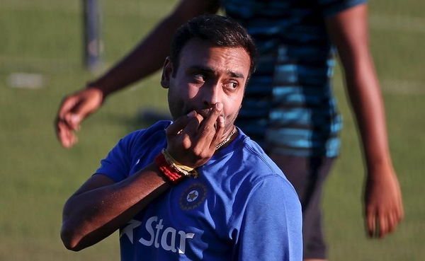 India’s Mishra whistles during a practice session ahead of their first Twenty-20 cricket match against South Africa in Dharamsala