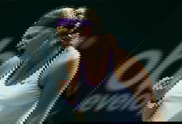 Petra Kvitova of the Czech Republic celebrates a point against Maria Sharapova of Russia during their women&#8217;s singles semi-finals tennis match of the WTA Finals at the Singapore Indoor Stadium