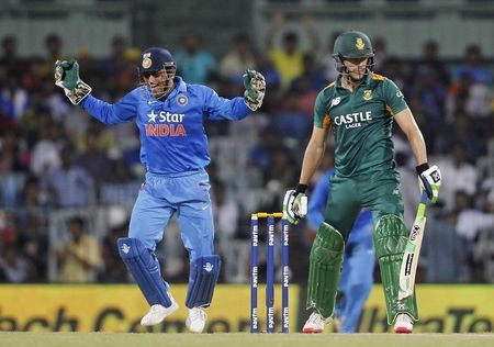 India&#8217;s captain and wicketkeeper Mahendra Singh Dhoni celebrates after taking the catch of South Africa&#8217;s Faf du Plessis during their fourth one-day international cricket match in Chennai