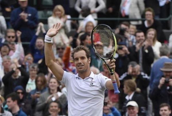 Richard Gasquet of France celebrates after winning his match against Stan Wawrinka of Switzerland at the Wimbledon Tennis Championships in London