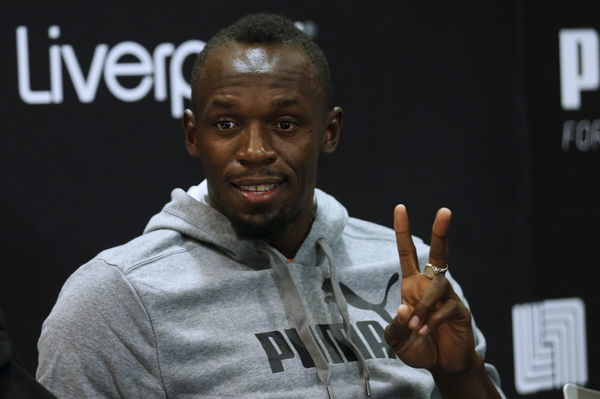 Jamaican sprinter Bolt gestures in a news conference during an event arranged by his sponsors in Mexico City