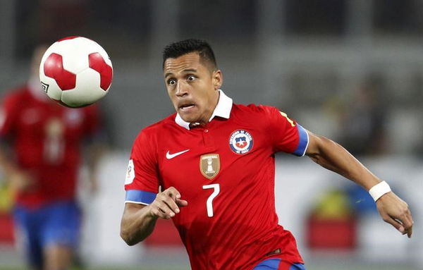 Chile&#8217;s Alexis Sanchez runs for the ball during their 2018 World Cup qualifying soccer match against Peru at Nacional stadium in Lima