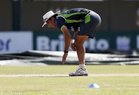 Pakistan&#8217;s captain ul-Haq inspects the pitch during a practice session ahead of their second test cricket match against Sri Lanka in Colombo