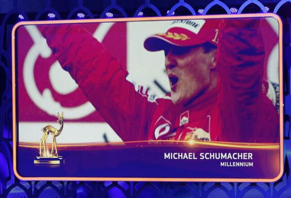 The portrait of German retired Formula One driver Schumacher is seen on a video screen as he is awarded with Millenium trophy during the Bambi 2014 media awards ceremony in Berlin