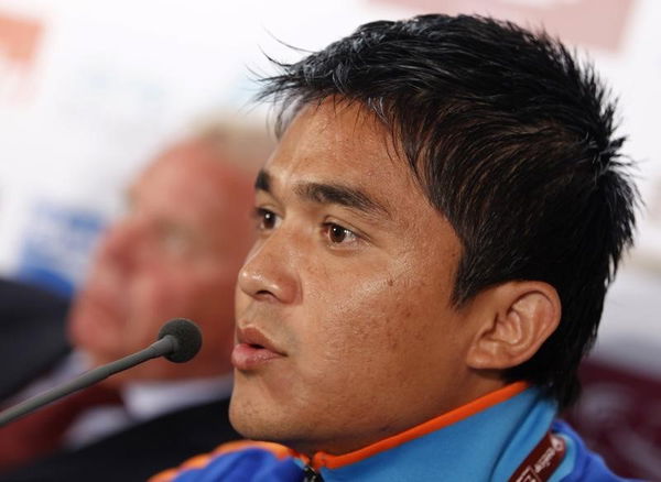 India&#8217;s national soccer team player Chhetri answers a reporter&#8217;s question besides his coach Houghton during a pre-match news conference for the Asian Cup soccer tournament in Doha