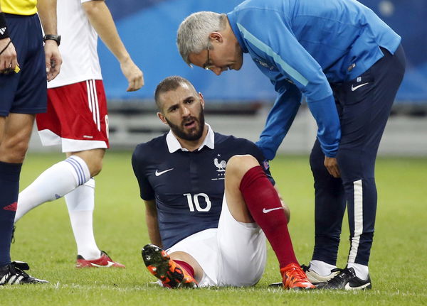 France&#8217;s Karim Benzema sits on the field after being injured during their friendly soccer match against Armenia at Allianz Riviera stadium in Nice