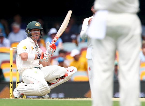 Australian batsman David Warner recover&#8217;s after being struck by a rising ball during the first cricket test match between Australia and New Zealand in Brisbane