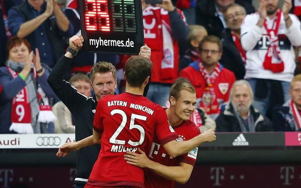 Munich&#8217;s Thomas Mueller comes off for Holger Badstuber during their Bundesliga first division soccer match against VfB Stuttgart  in Munic