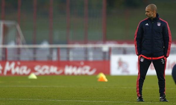 Coach Guardiola of Bayern Munich watches training session before Champions League soccer match against Arsenal in Munich