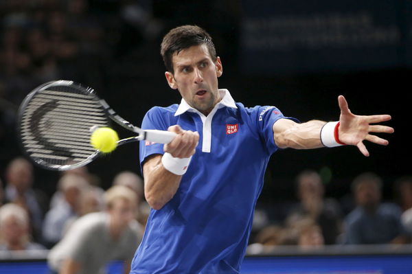 World number one Novak Djokovic of Serbia returns to Stan Wawrinka of Switzerland in their men&#8217;s singles semi-final tennis match at the Paris Masters tennis tournament