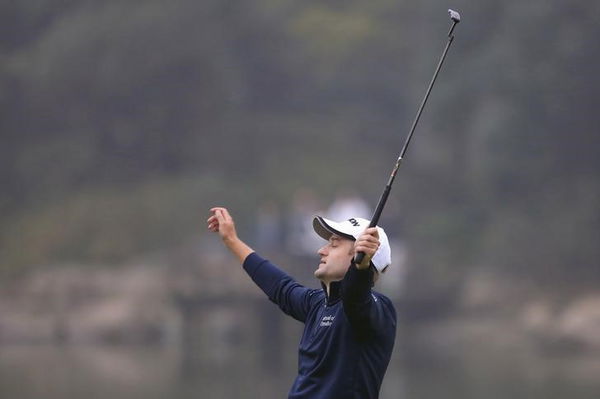 Russell Knox of Scotland reacts after winning the WGC-HSBC Champions golf tournament in Shanghai