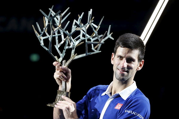 Djokovic poses with the trophy after beating Murray in their men&#8217;s singles final tennis match at the Paris Masters tennis tournament