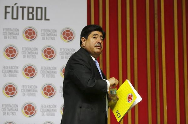 Colombian soccer federation president Luis Bedoya leaves after a news conference in Bogota