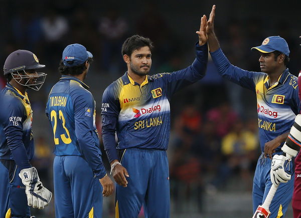 Sri Lanka&#8217;s Siriwardana celebrates with team mates after taking the wicket of West Indies&#8217; Charles during their second One Day International cricket match in Colombo